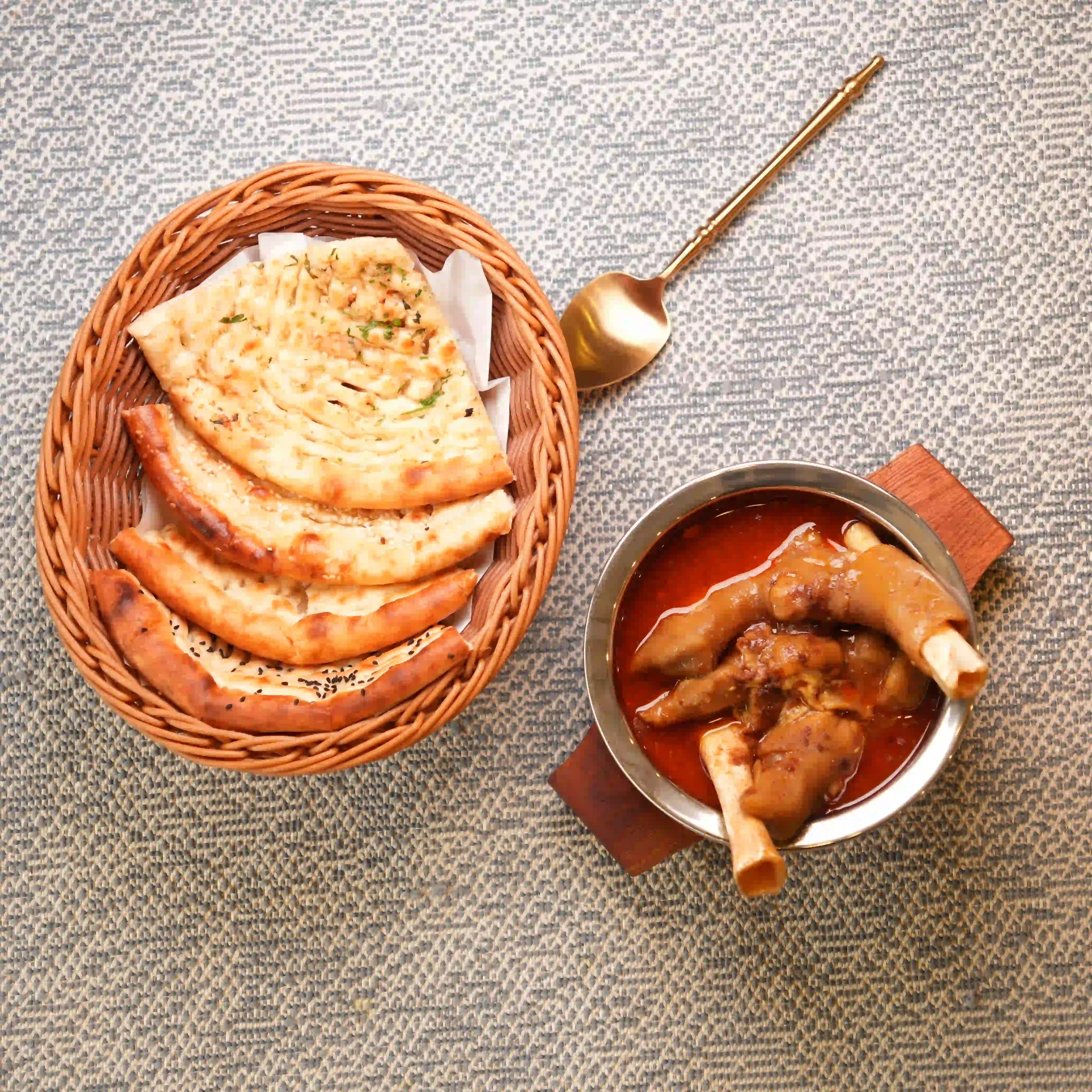 Mutton paya served with naan for Sunday mess breakfast at Zafran Kitchen Ajman